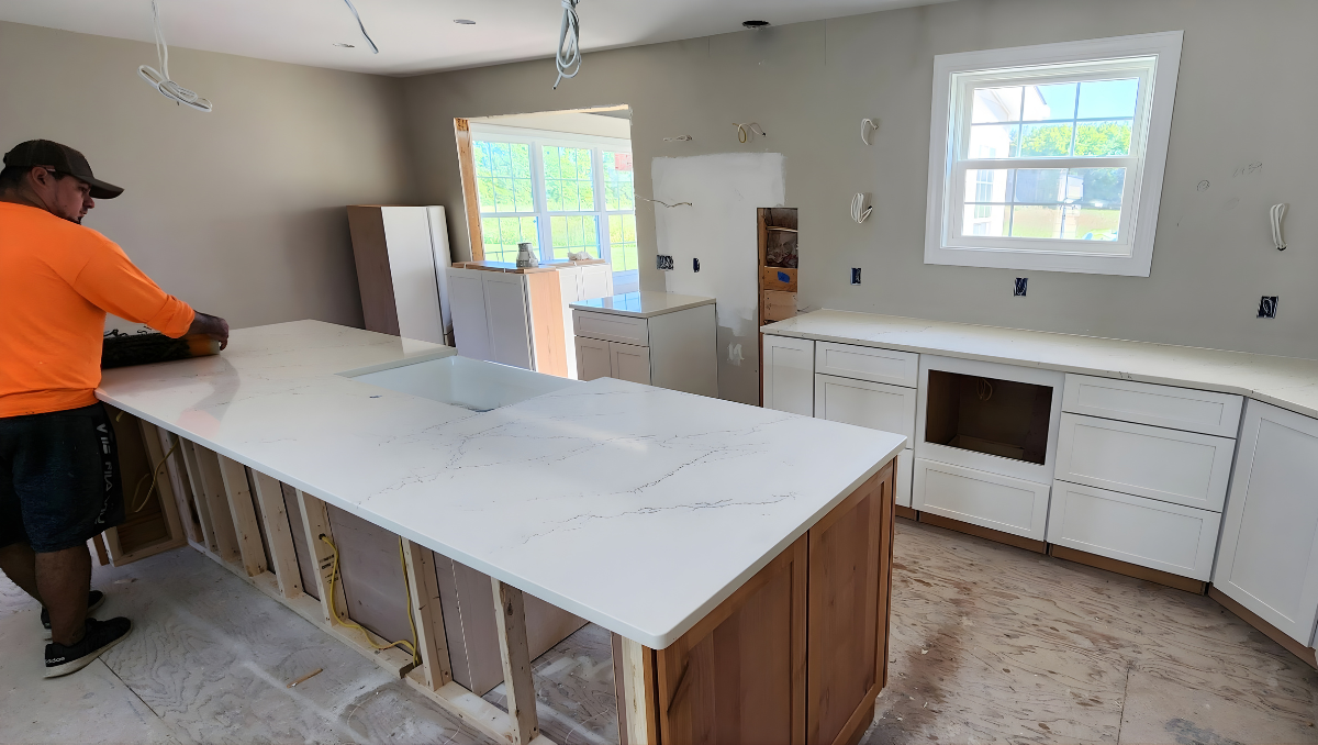 Kitchen remodeling project in progress with new cabinets and island installation