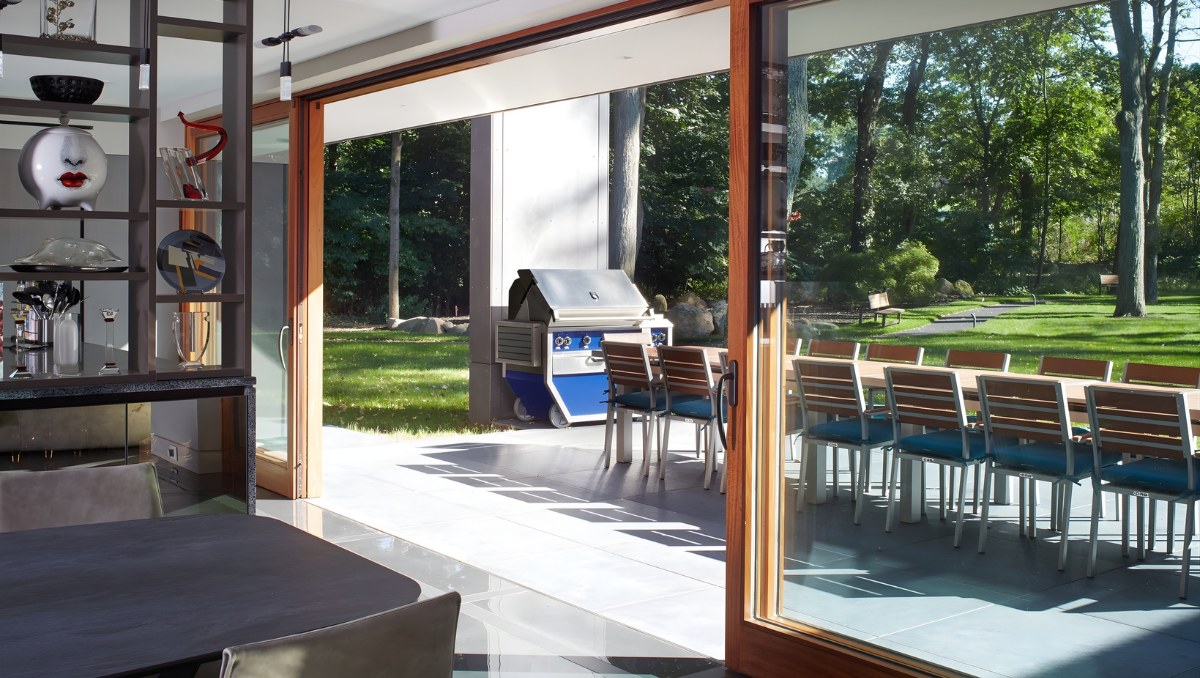 Sliding glass doors opening to patio in coastal home