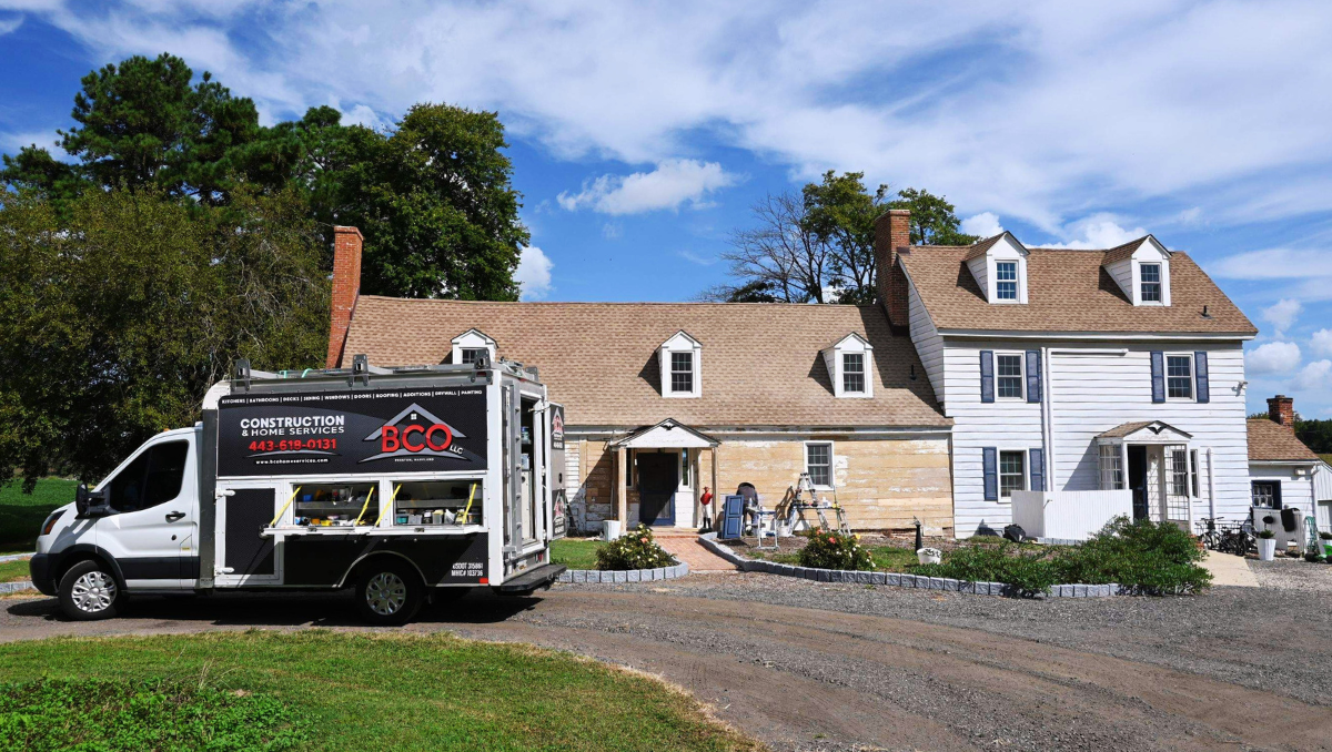 Exterior sanding and preparation work on historic wood siding