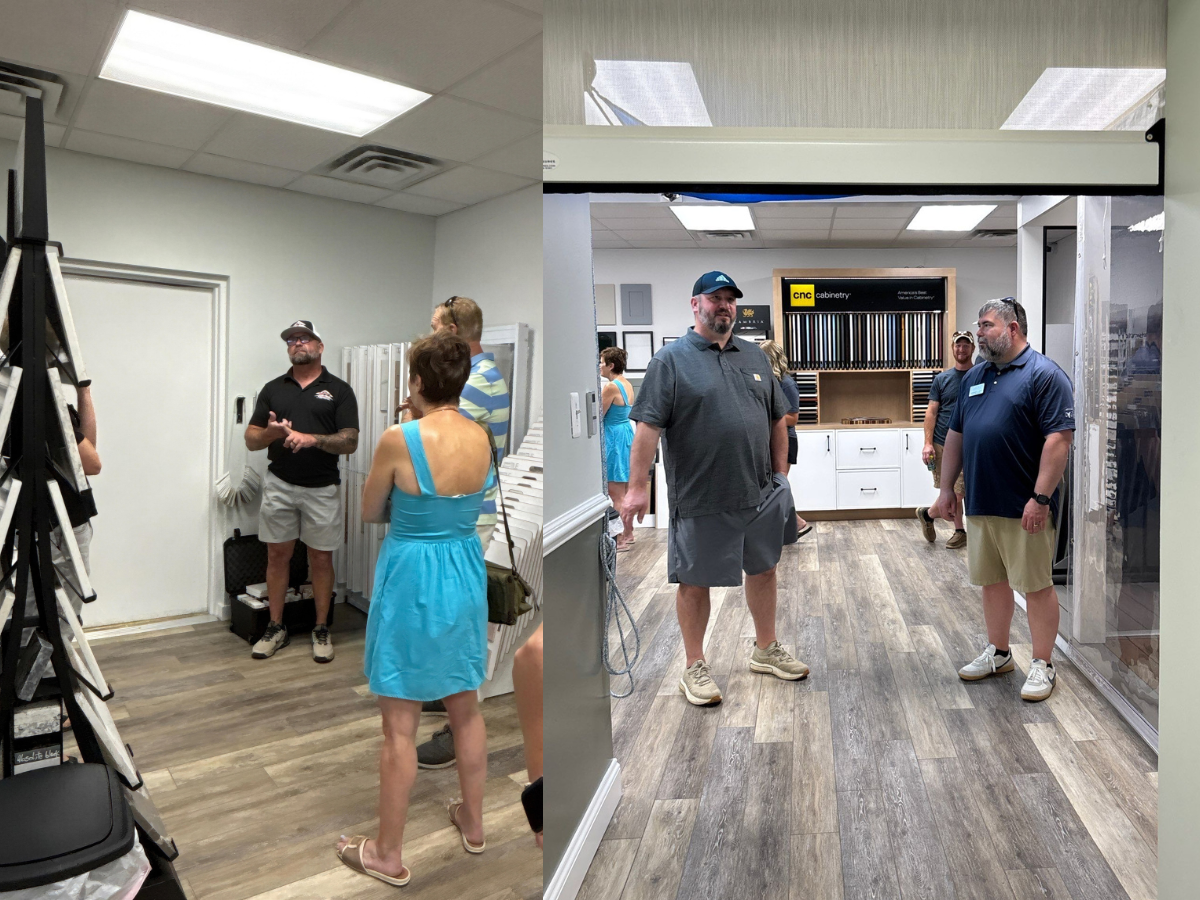 Visitors tour the Home & Outdoor Living Showroom in Denton, Maryland, viewing flooring, cabinetry, countertop displays, and outdoor living products during the grand opening event.