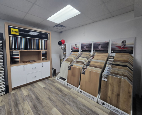Republic Flooring displays showcasing luxury waterproof flooring samples at the BCO Home & Outdoor Living Showroom in Denton, MD.