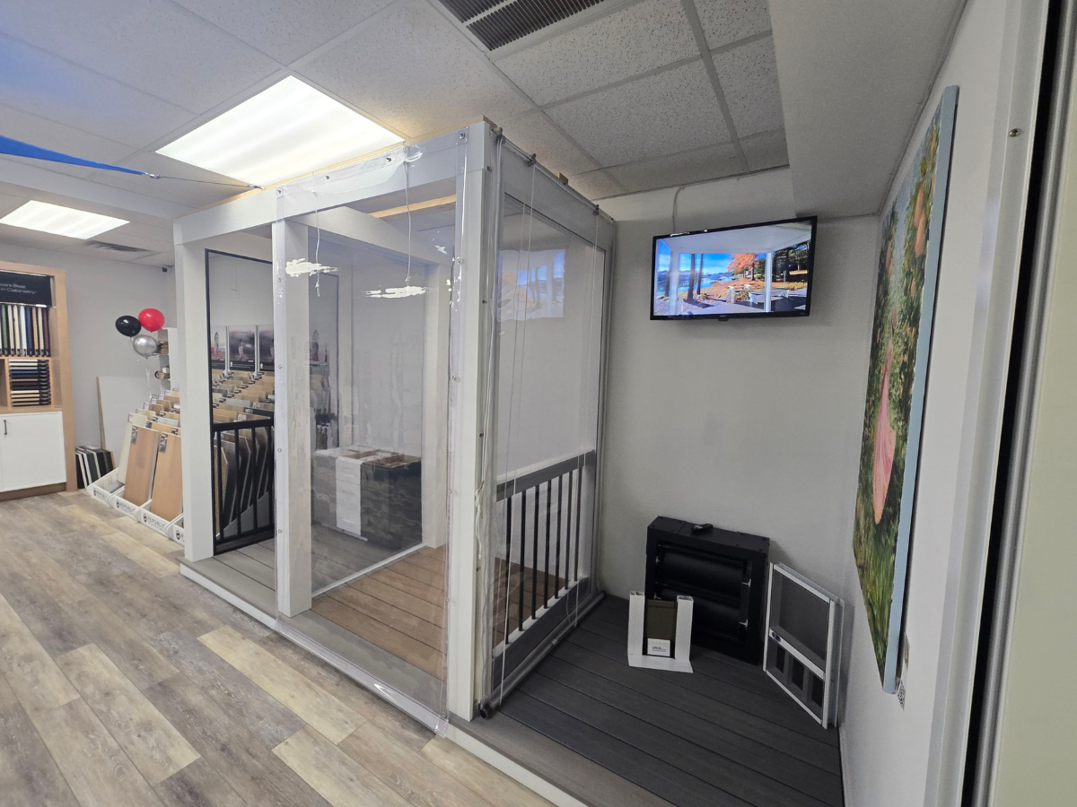 Full-size vinyl porch enclosure display inside the BCO Home & Outdoor Living Showroom in Denton, MD, featuring premium clear vinyl panels and outdoor living solutions.