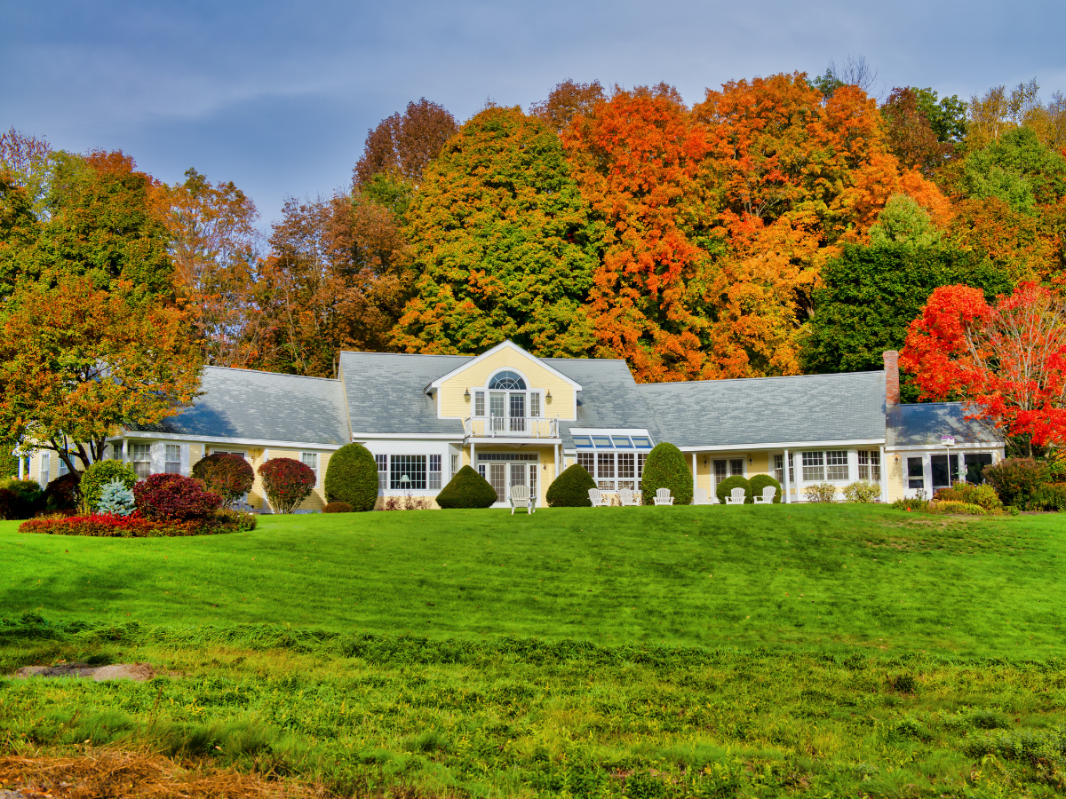 Beautiful Eastern Shore home surrounded by colorful fall foliage ready for seasonal home maintenance