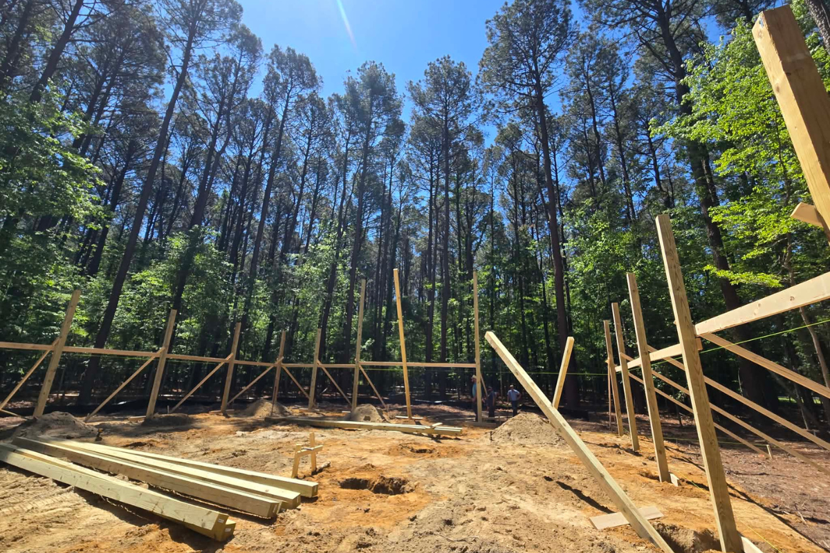 Wooden posts installed at the beginning of a Tilghman Island pole barn construction project