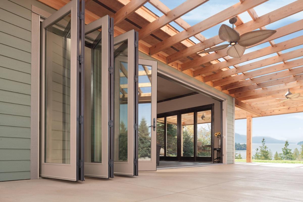 Open stacking glass doors connecting a home to a covered patio